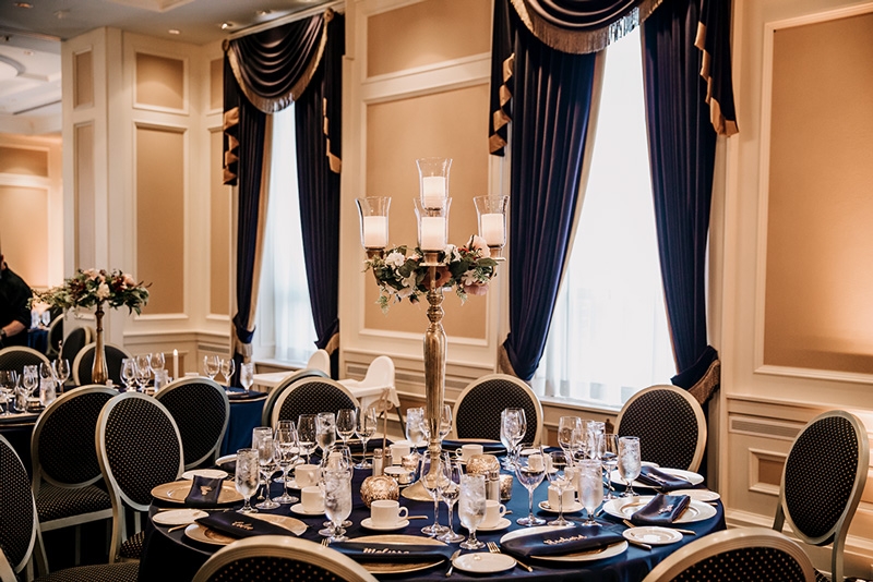Decorated Grand Ballroom II wedding reception (navy, burgundy, gold). Photo by Luxe Images by Jill.